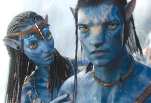 Two blue-skinned, humanoid characters with yellow eyes and striped markings, wearing beaded jewelry and looking serious. One stands close behind the other, gently resting a hand on their shoulder.
