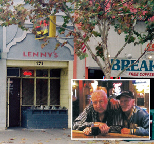 A storefront with the sign LENNYS above the entrance is partially obscured by a tree. Inset is a photo of two older men sitting closely together at a counter inside, one with his arm around the other.