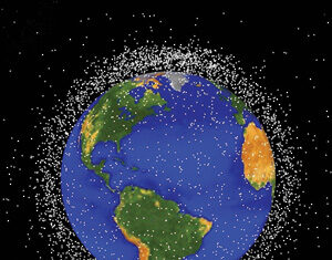 Illustration of Earth with numerous small white dots surrounding it, representing space debris or satellites in orbit, set against a black background with visible continents of the Americas, Africa, and Europe.