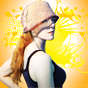 Woman with long reddish hair in a ponytail, wearing a sleeveless black top and a light brown hat, stands in front of a bright yellow and orange abstract background with swirling lines and dots.