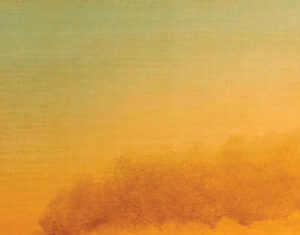A plume of dark smoke rises and drifts to the right against a soft gradient sky, transitioning from yellow to orange, suggesting sunrise or sunset over a distant horizon.