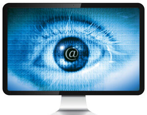 A computer monitor displays a large blue eye with binary code and an @ symbol in the iris, symbolizing digital surveillance or internet privacy concerns.