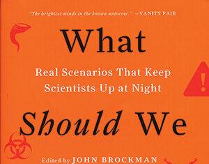 Book cover with an orange background displaying the title What Should We Be Worried About?, edited by John Brockman. It lists notable contributors and features caution symbols and scientific icons.