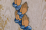 Five pairs of hands in a praying gesture, stacked vertically, with blue sleeves, illustrated against a light wood-textured background.