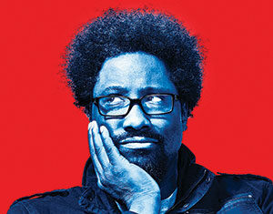 A person with curly hair, glasses, and a beard rests their face on one hand, looking thoughtful. The image has a blue tint, and the background is bright red.