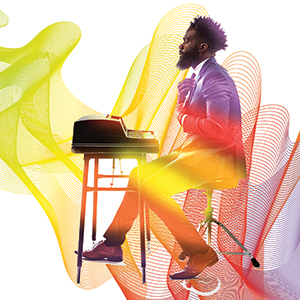 A man in a suit sits at a vintage typewriter on a stool, surrounded by colorful, abstract swirls of red, yellow, and orange on a white background.