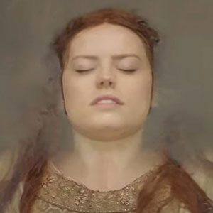 A woman with closed eyes and reddish-brown hair lies on her back, partially submerged in water, wearing an ornate, embroidered garment.