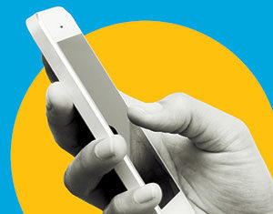 A close-up of a hand holding a smartphone against a background with a yellow circle on a blue field.