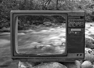 Hollow TV screen with a river behind it