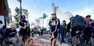Group of people congregating on a San Jose street intersection