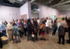 Crowd of people at an art museum event