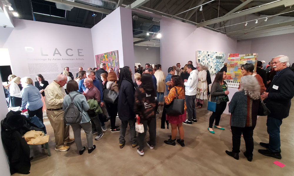 Crowd of people at an art museum event