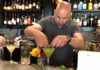 Man mixing a drink at a bar