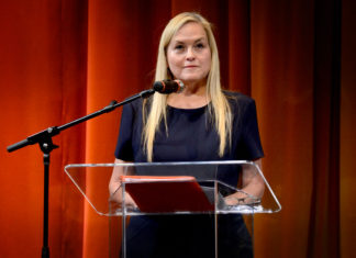 Photo of woman in front of a lectern