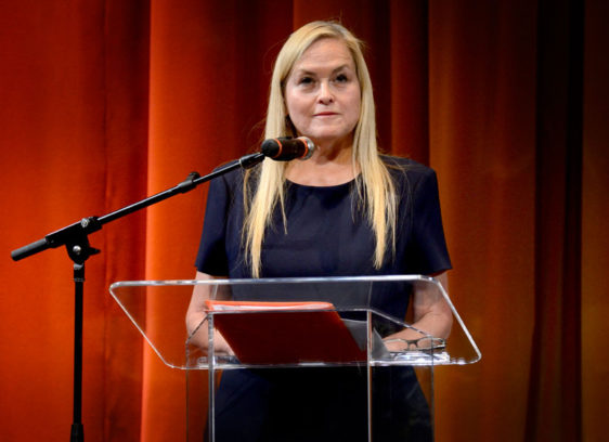 Photo of woman in front of a lectern
