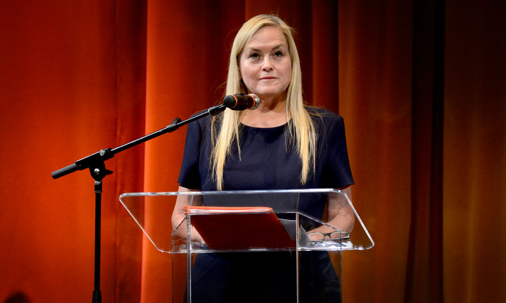 Photo of woman in front of a lectern