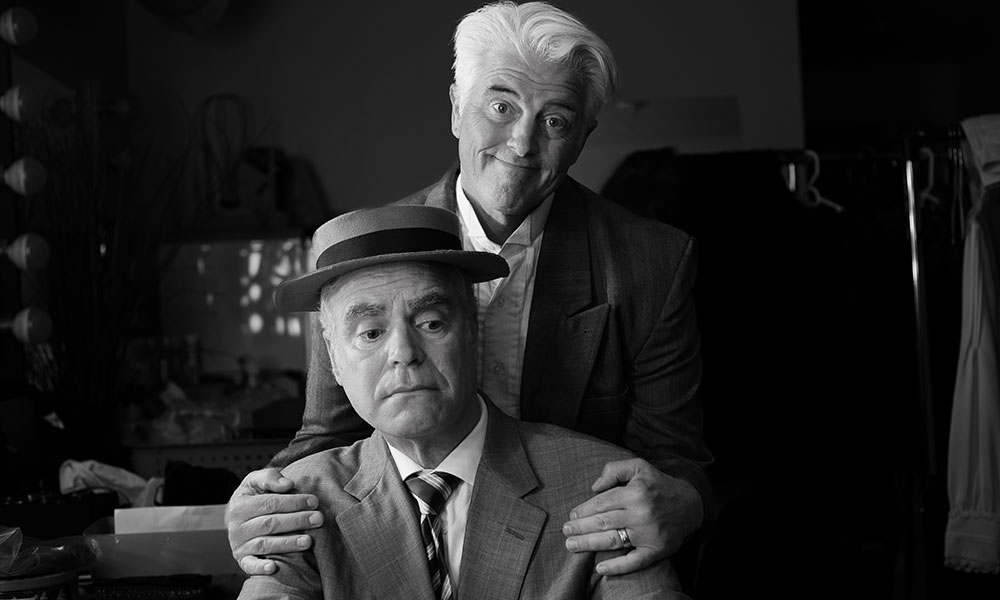 Black-and-white photo of two men in old-fashioned suits