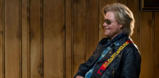 photo of man playing guitar