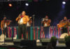 Mariachi singer on stage with other musicians