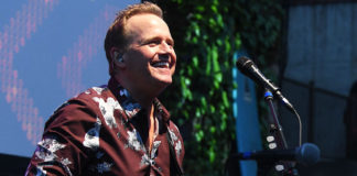 Man playing guitar onstage