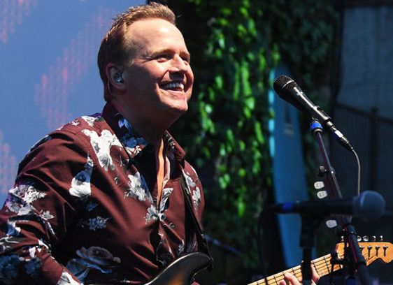 Man playing guitar onstage