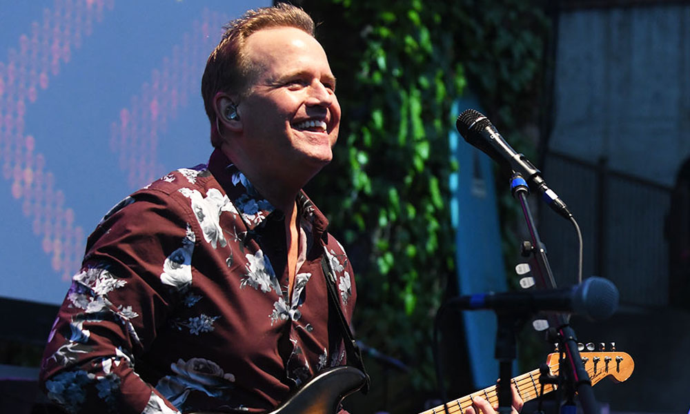 Man playing guitar onstage