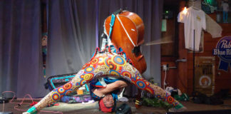 Man playing a cello upside down