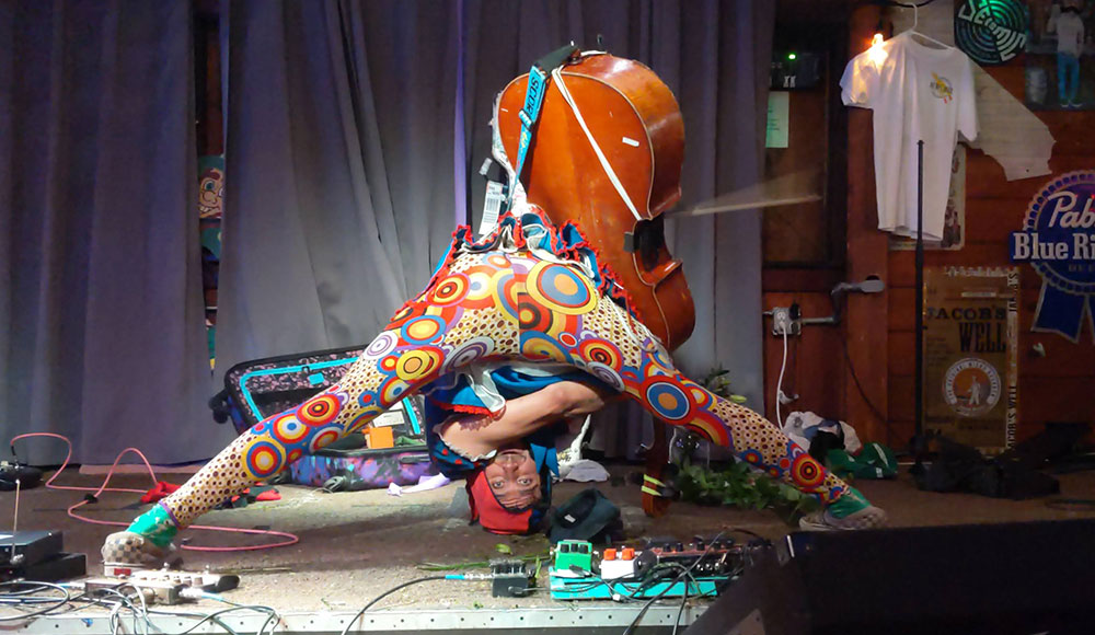 Man playing a cello upside down