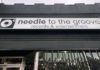 Needle to the Groove storefront with sign