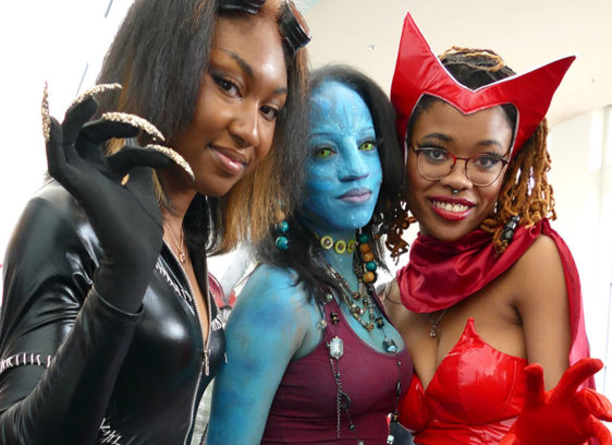 Three women dressed as science fiction/superhero costumes