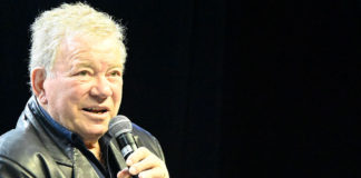 William Shatner speaking into a microphone