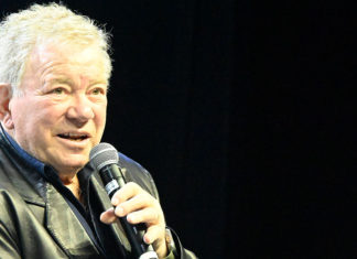 William Shatner speaking into a microphone