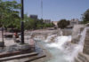 Urban fountain with water flowing over cement steps