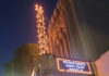 Front of a theater with the marquee advertising an appearance by Nancy Pelosi