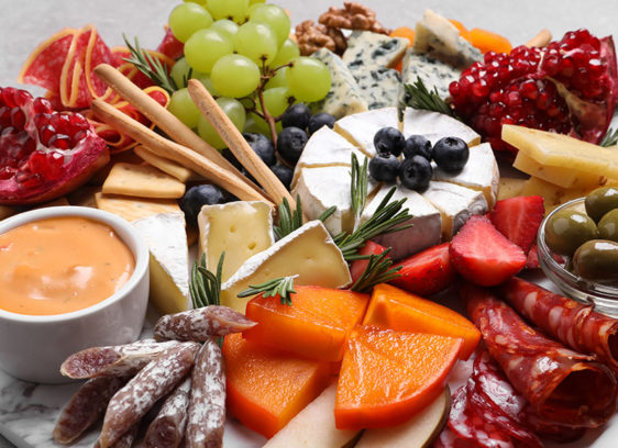 Cheese board with fruit and charcuterie