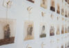 sideways view of images lined up on a wall in rows