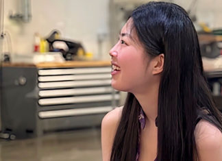 Woman turned to the side talking to someone