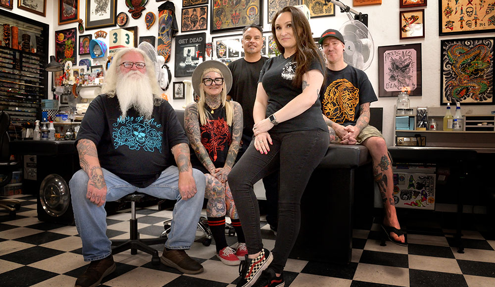 Group of people in a tattoo shop