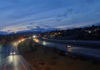 Freeway at twilight, cars driving with headlights