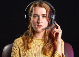 Woman wearing headphones looking straight at the camera