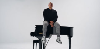 Man sitting on a piano