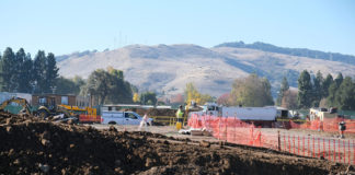 Construction site with mountain scenery behind it