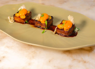 Platter of intricately decorated pieces of meat
