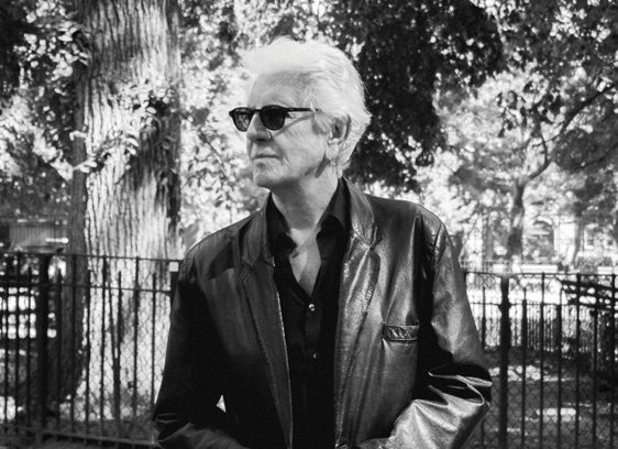 Man standing outside around trees