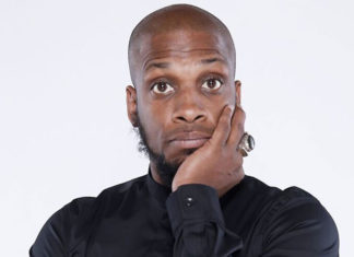 Head shot of a man with his hand on his chin, looking quizzical