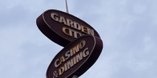 Sign with two ovals that say "Garden City" and "Casino & Dining"