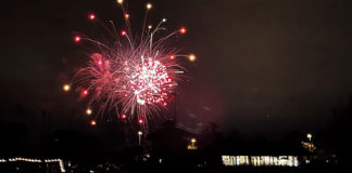 Fireworks seen over a lake