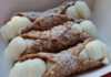 Three cannoli on a plate