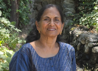 Woman posing for a photo outside