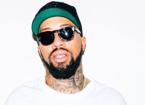 Bearded man wearing sunglasses and a hat